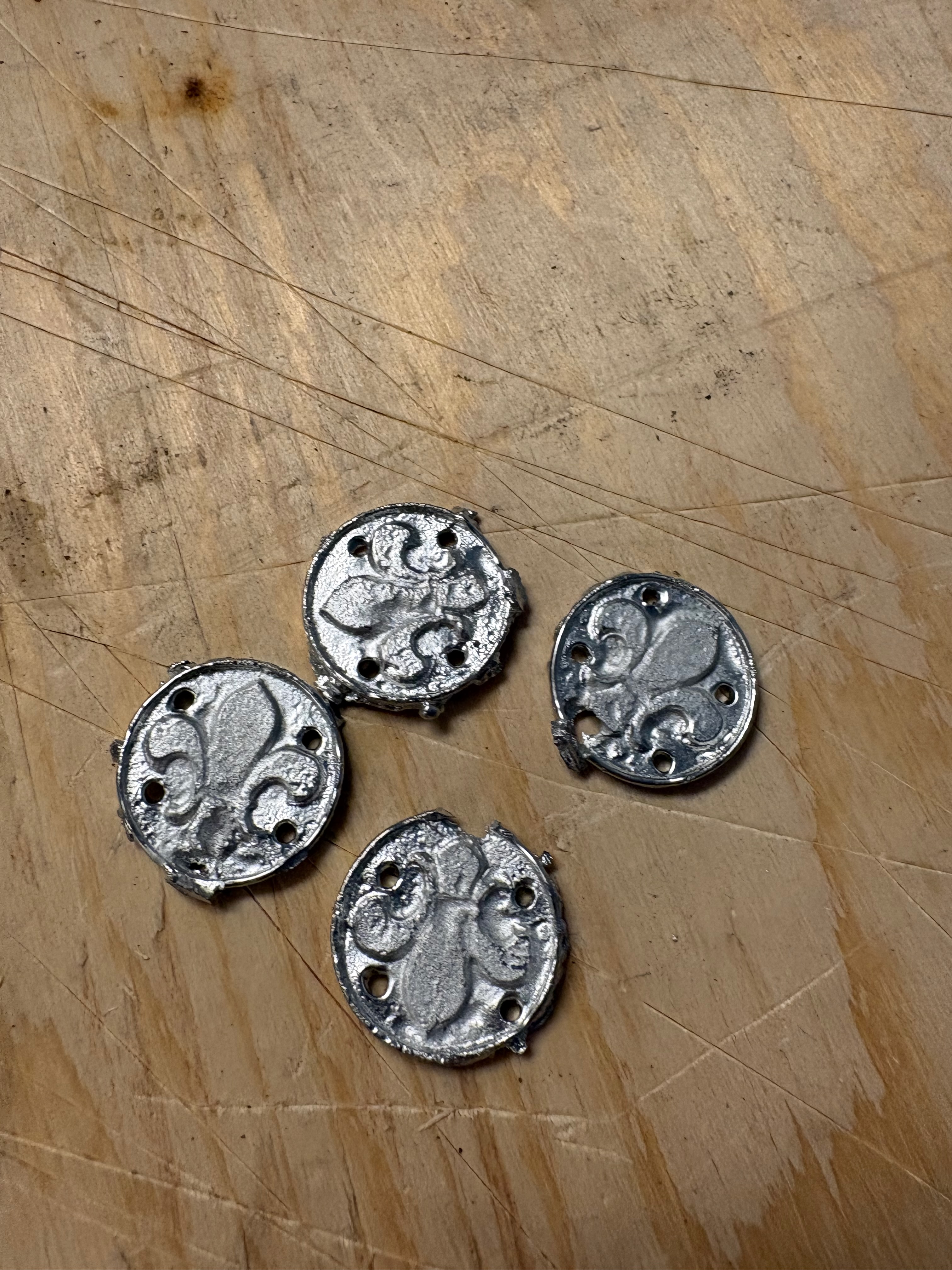 Finished tin scout badges.